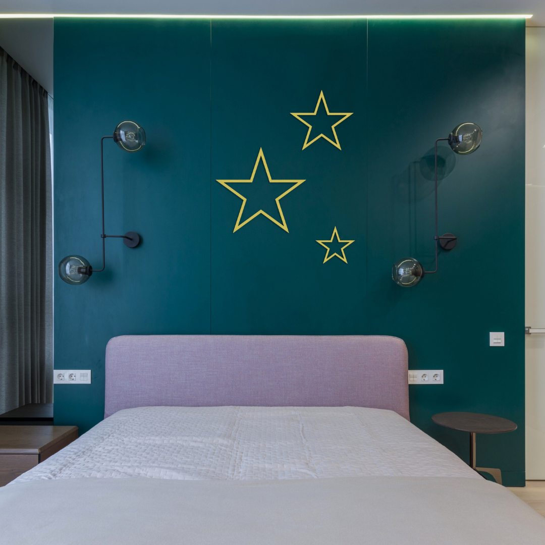 golden stars trio metal wall art on wall in bedroom