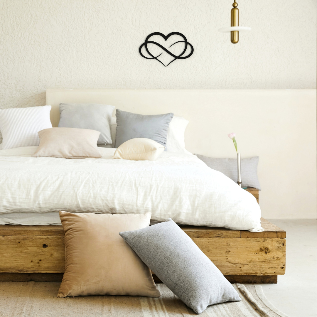 black infinity heart metal wall art on wall in bedroom