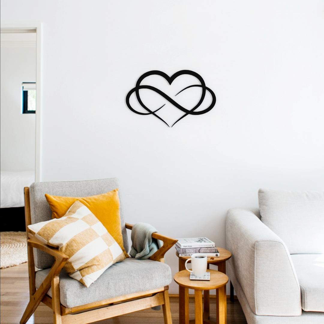 black infinity heart metal wall art on wall in living room