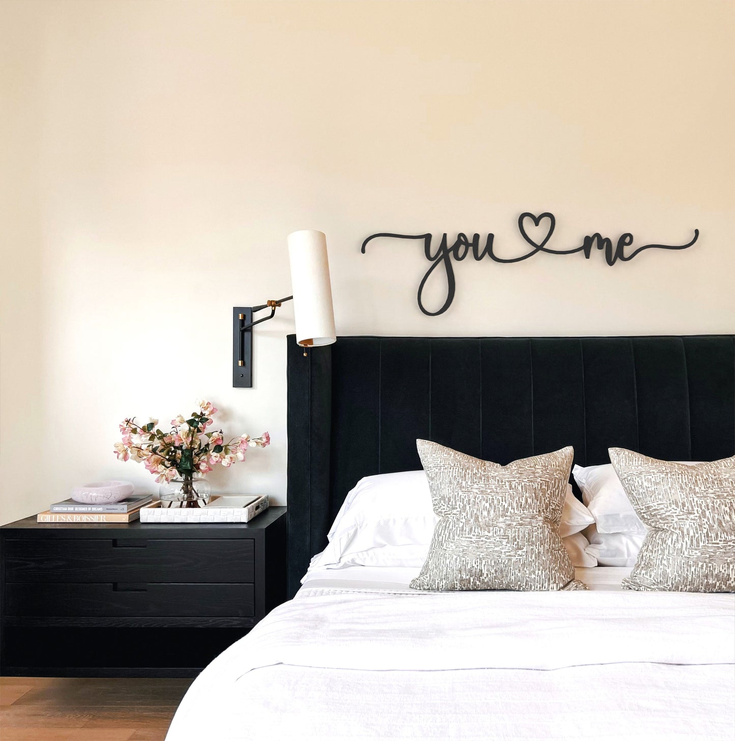 black-you-and-me-metal-sign-on-wall-in-modern-bedroom