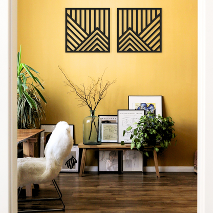 black geometric mountains metal wall art on a wall in office room