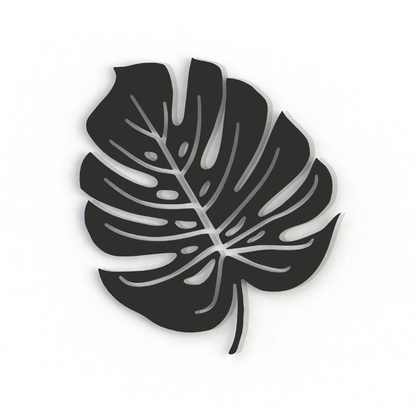 black monstera leaf metal wall art on a white background