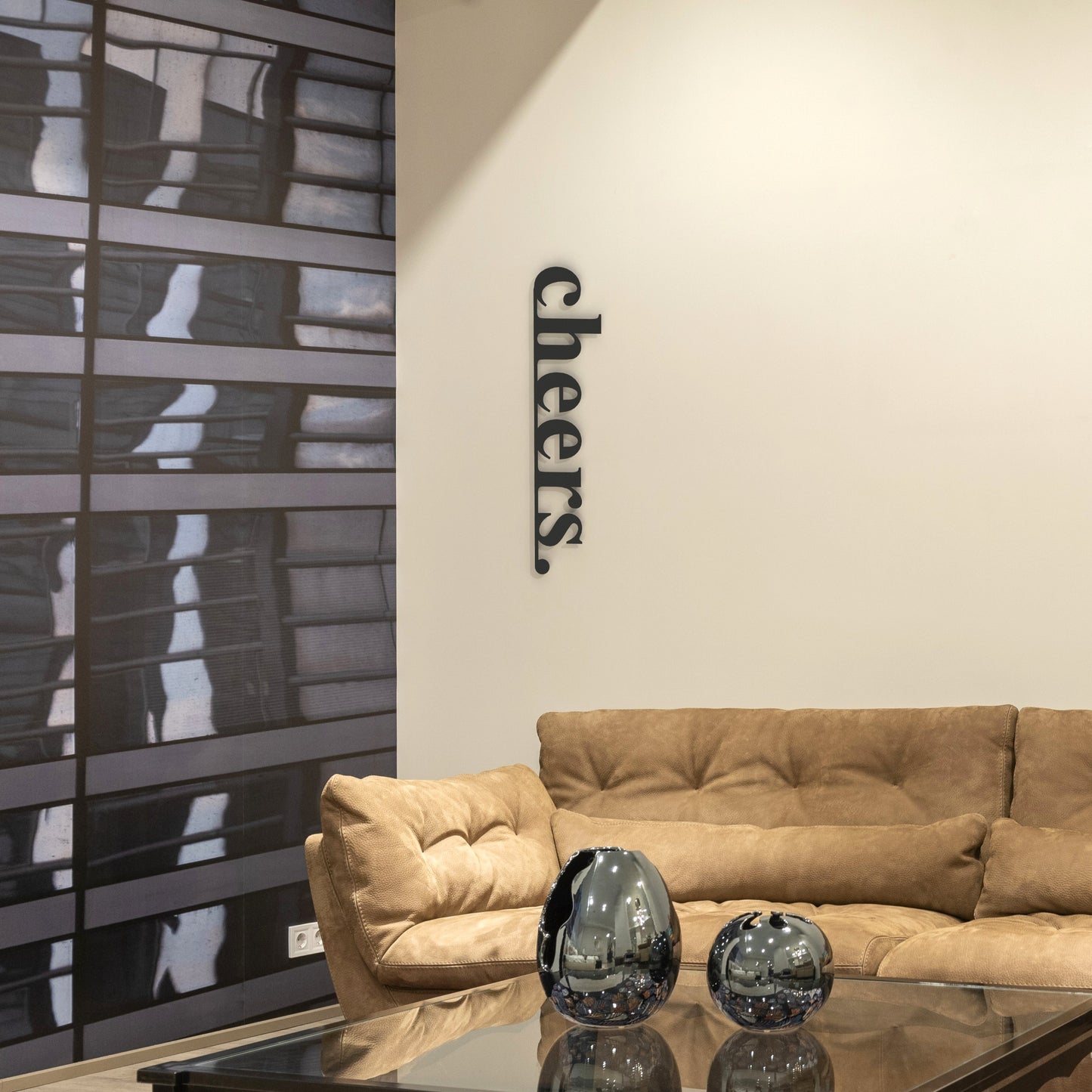 black cheers stand-off metal sign on wall in living room