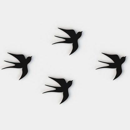 black swallows set of four on a white background