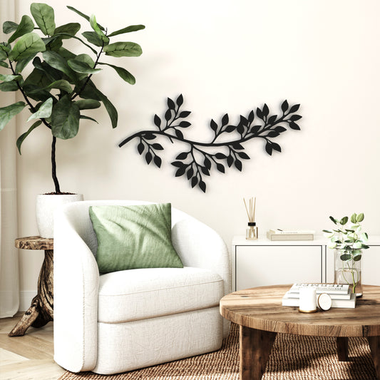 black tree branch with leaves stand-off metal wall art hangs on wall in living room