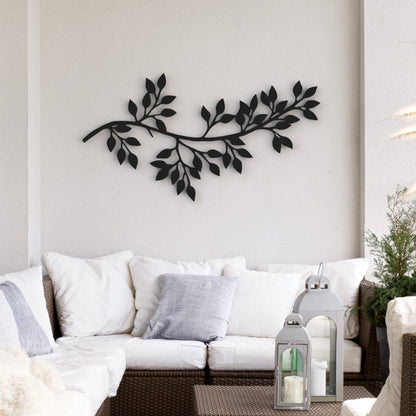 black tree branch with leaves stand-off metal wall art hangs on wall on balcony