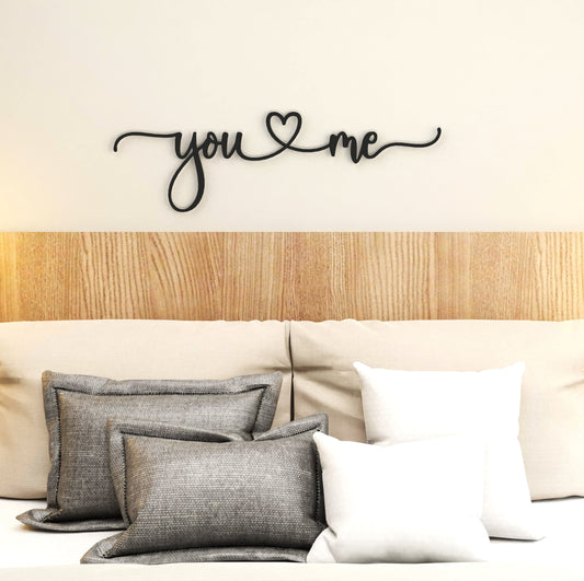 black-you-and-me-metal-sign-on-wall-in-bedroom