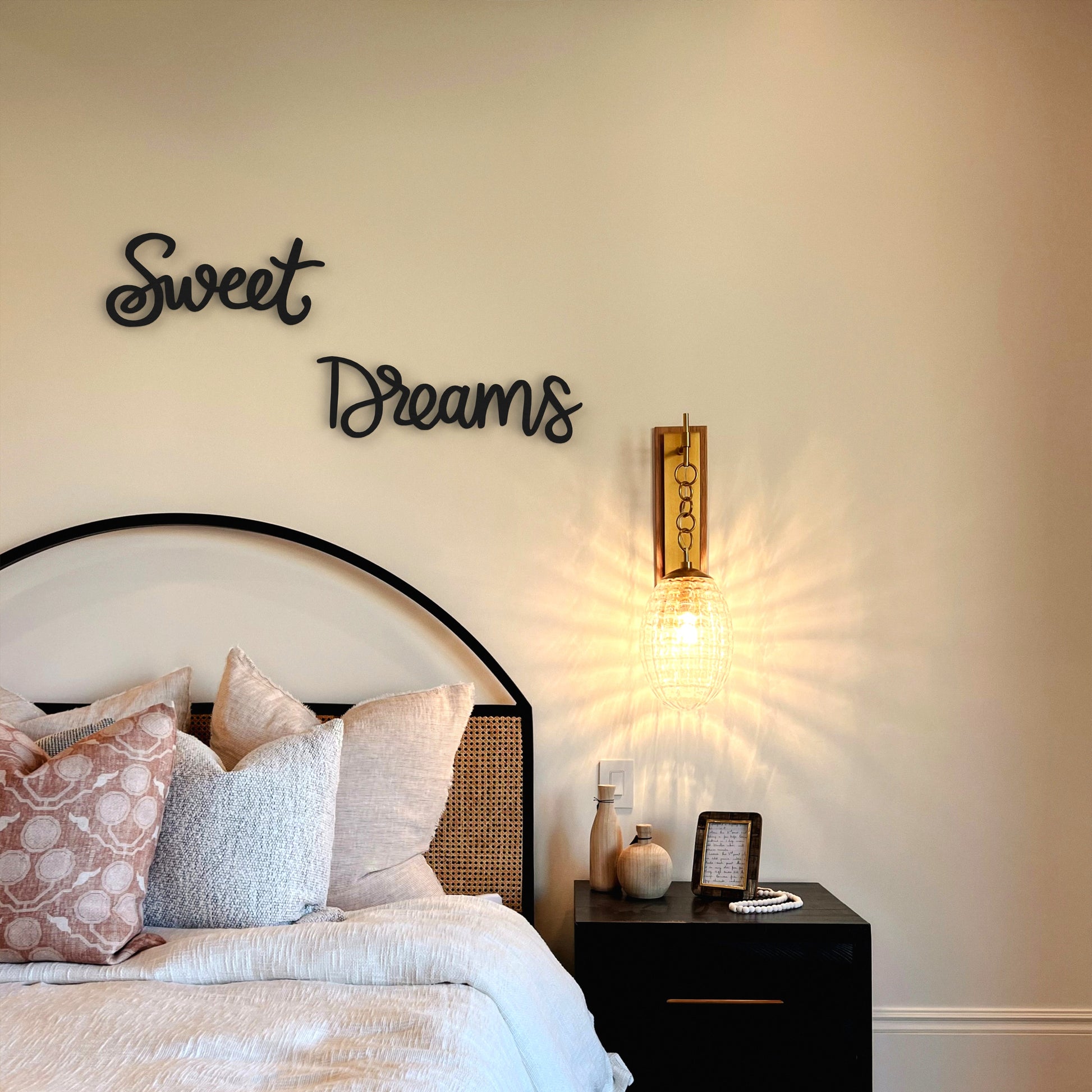 sweet-dreams-black-metal-sign-cursive-font-on-wall-in-bedroom