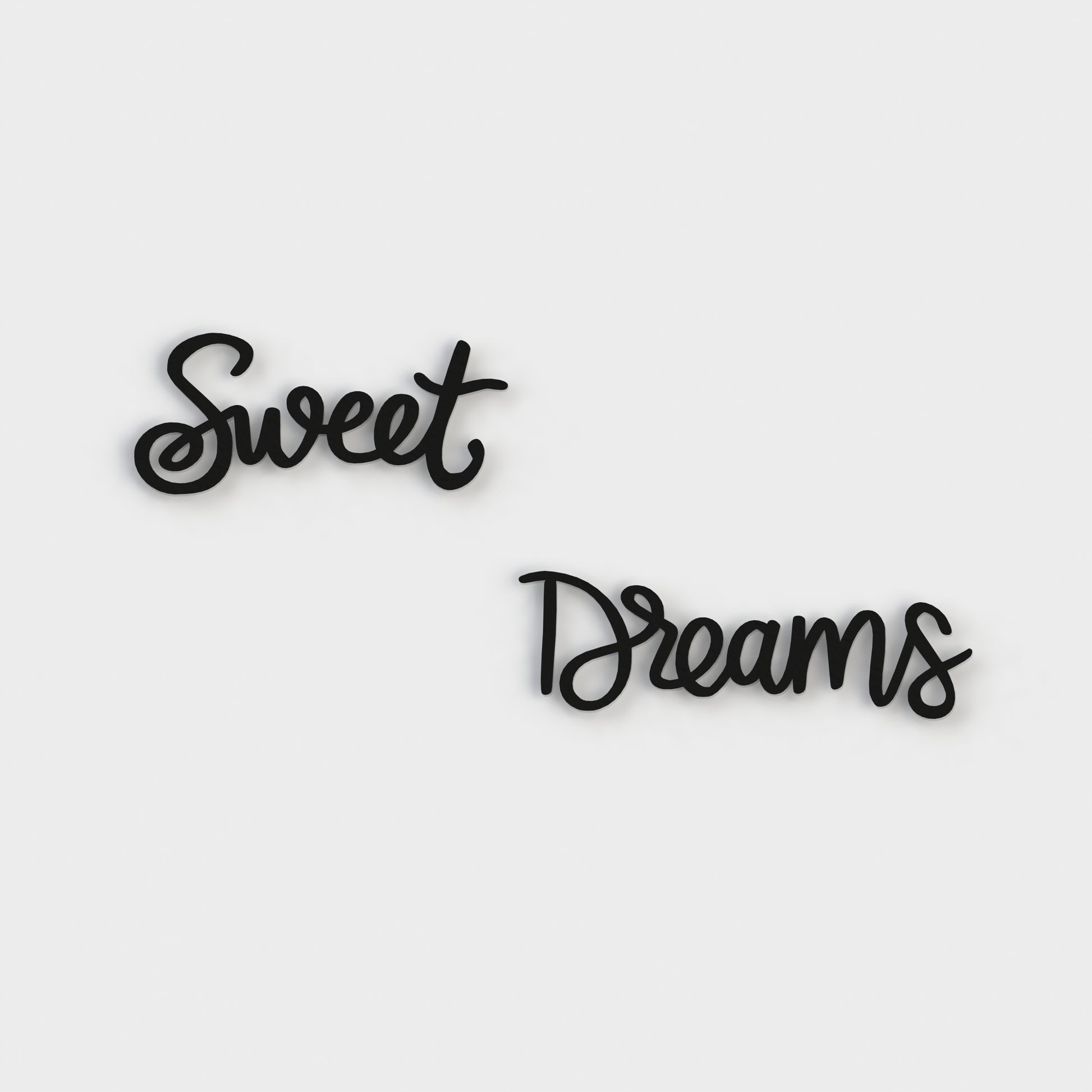 sweet-dreams-golden-metal-sign-cursive-font-on-a-white-background