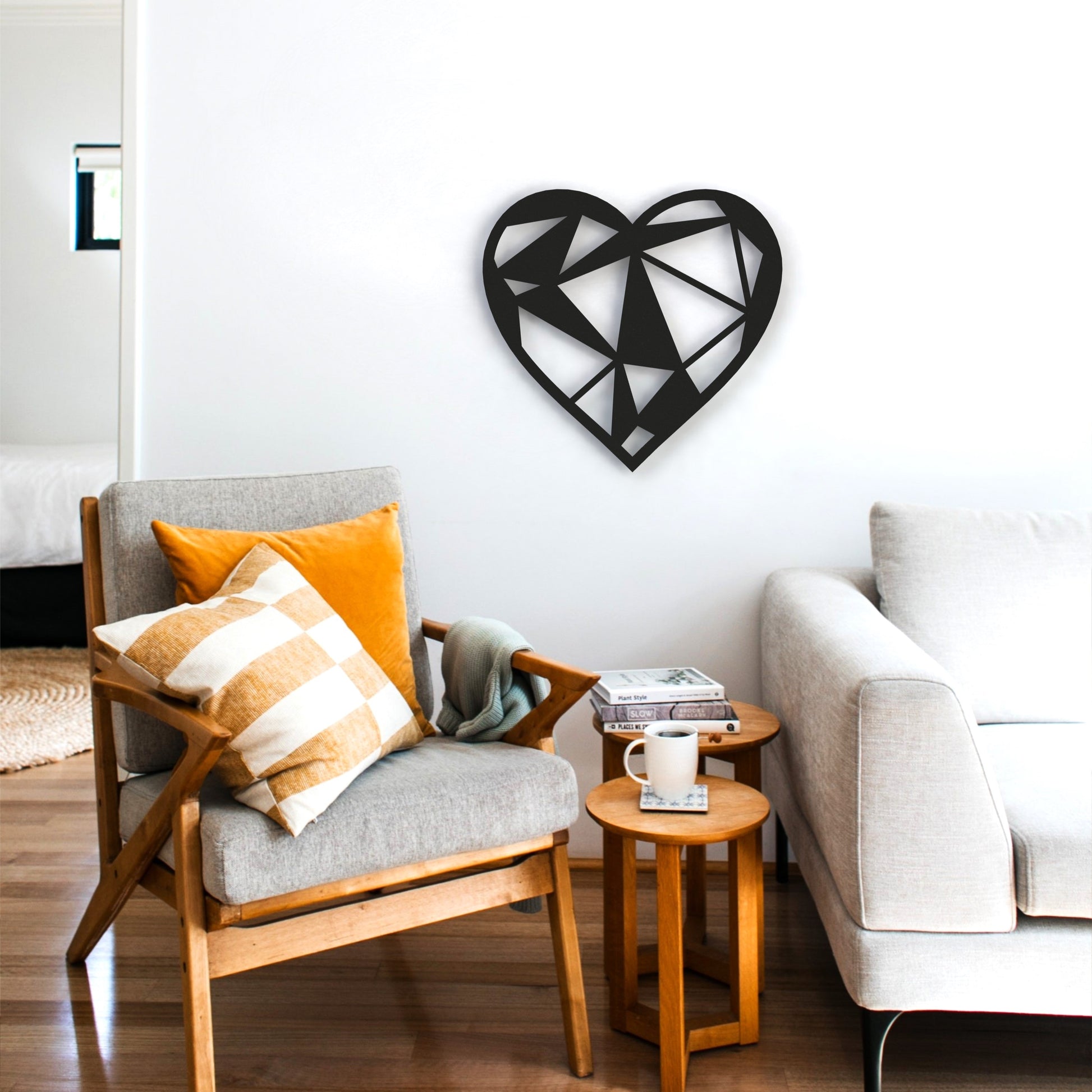 black-geometric-heart-metal-wall-art-on-white-wall-in-living-room